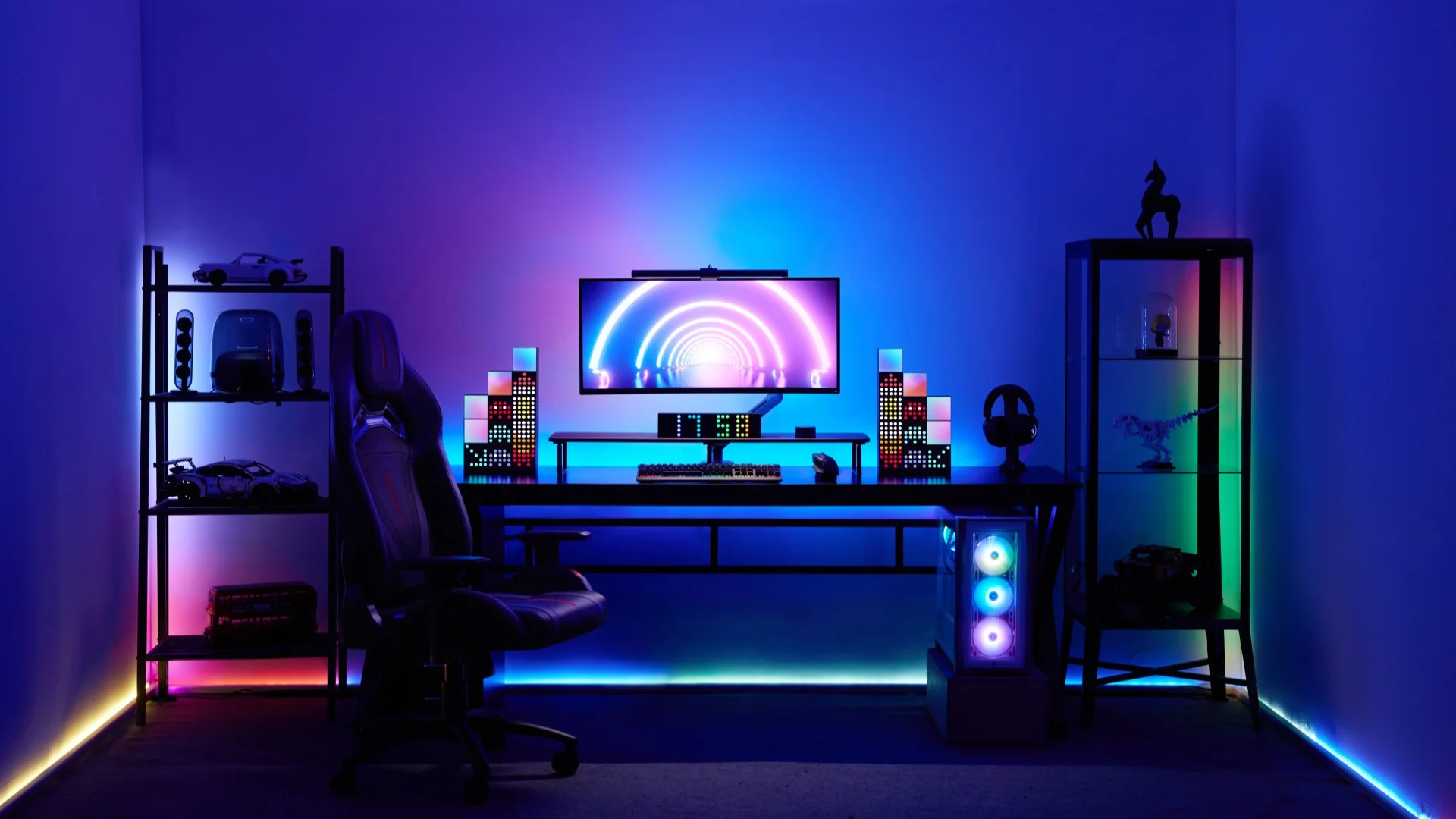 High-tech glowing gaming station with multiple monitors and mechanical keyboard